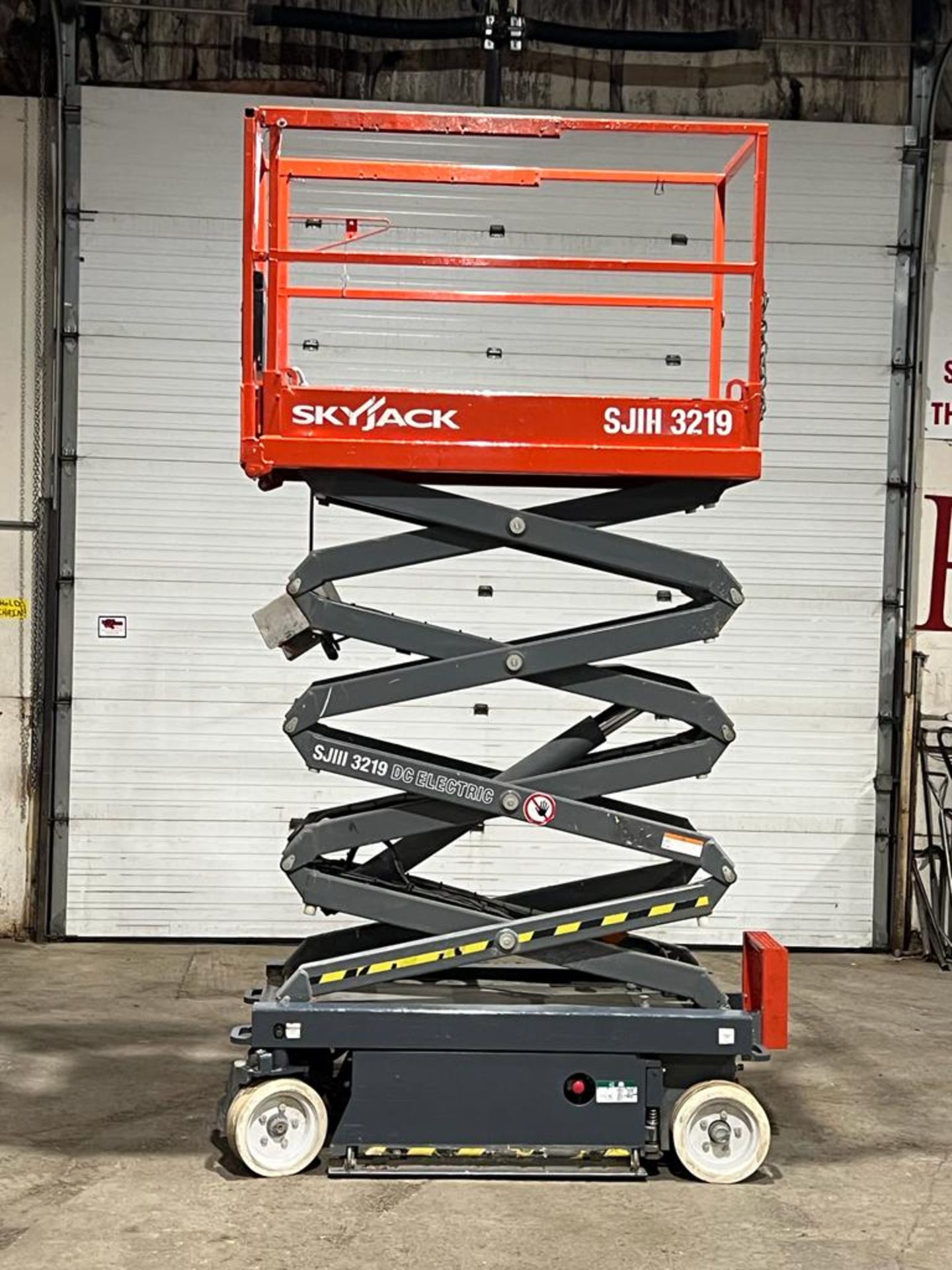 2013 SkyJack III Electric Scissor Lift model 3219 - 19 feet lift, 32 inch width deck with pendant