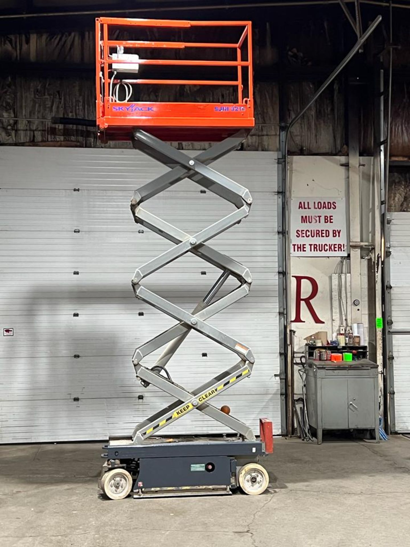 2013 SkyJack III Electric Scissor Lift model 3219 - 19 feet lift, 32 inch width deck with pendant