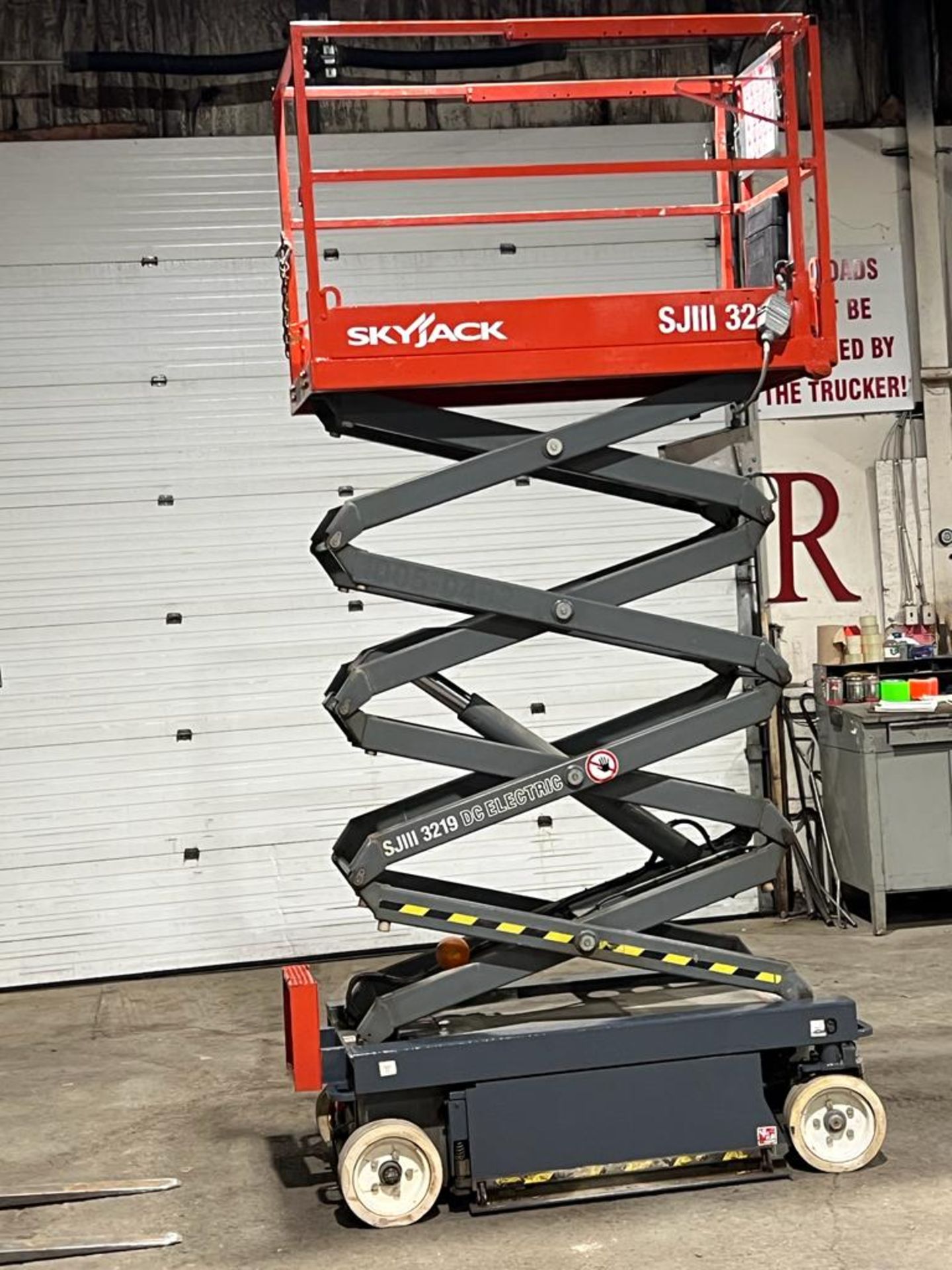 2013 SkyJack III Electric Scissor Lift model 3219 - 19 feet lift, 32 inch width deck with pendant