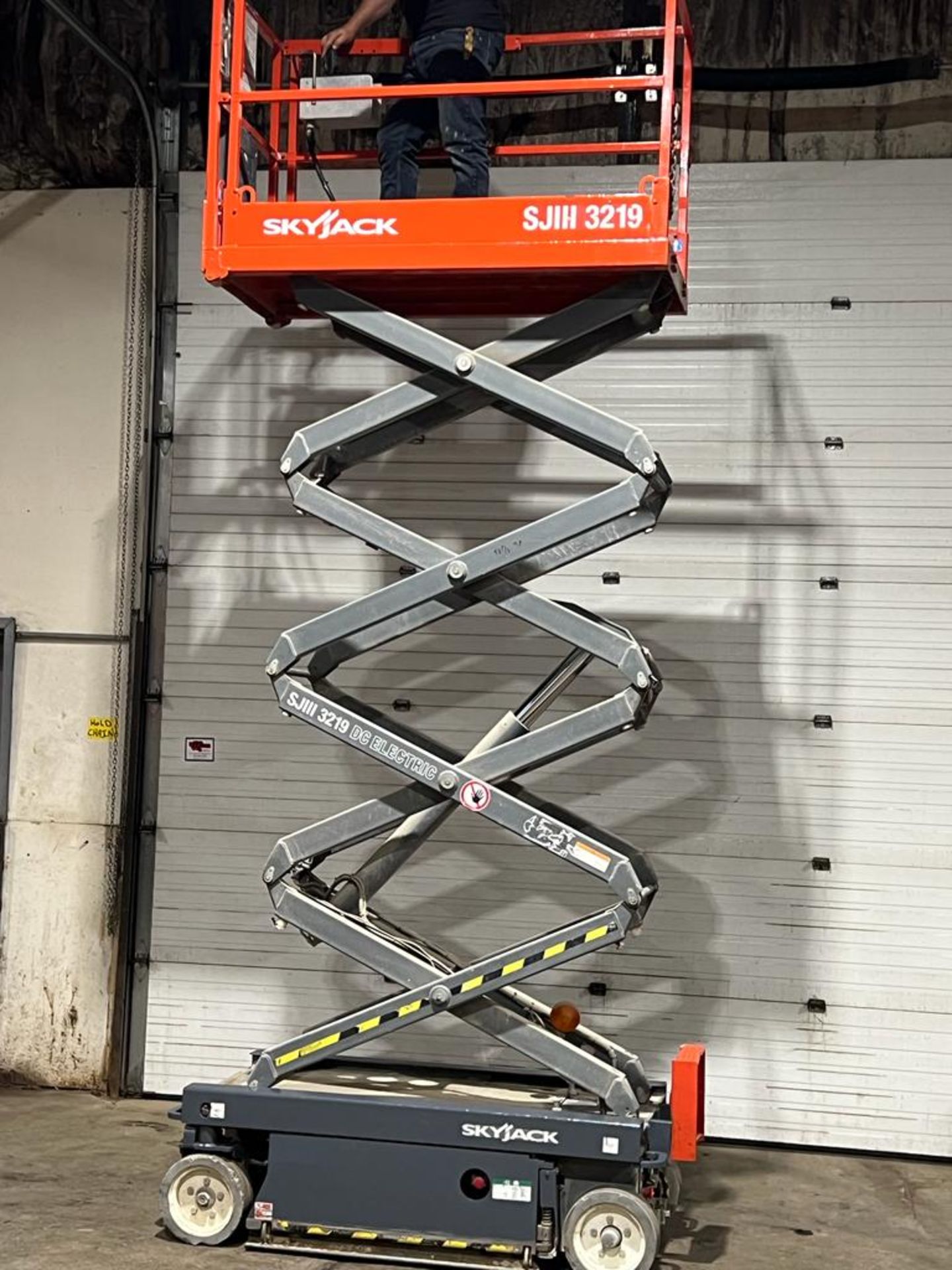 2013 SkyJack III Electric Scissor Lift model 3219 - 19 feet lift, 32 inch width deck with pendant