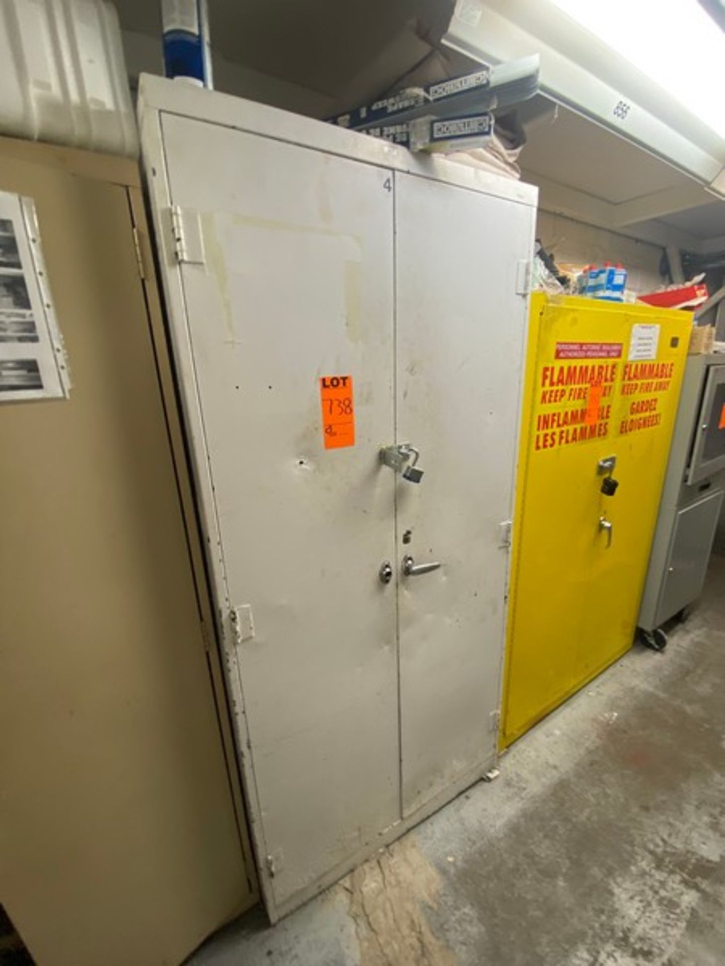 Double Door Storage Cabinet, Includes Contents (LOCATED IN SAINT-LAMBERT, QC)