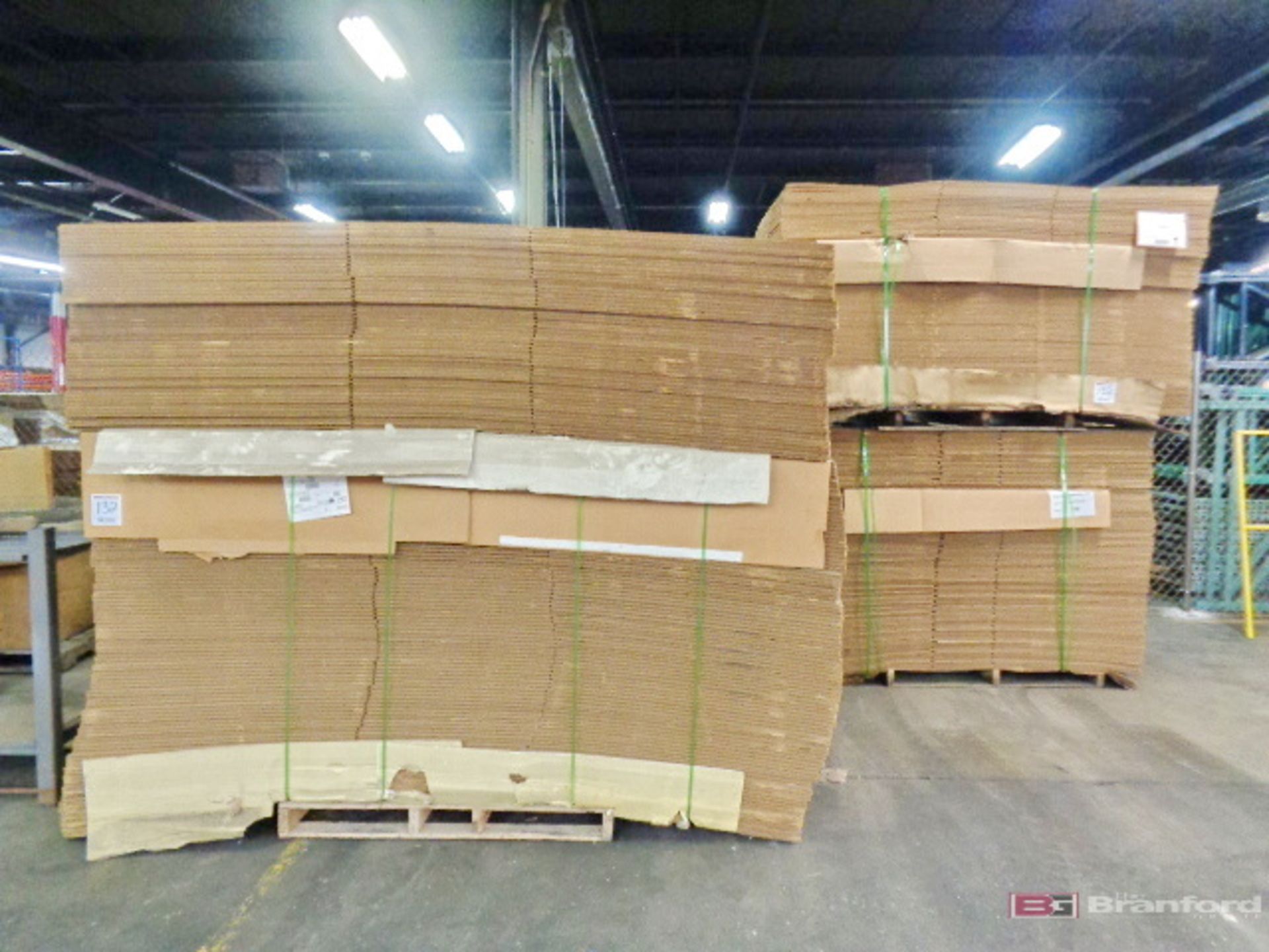 Large Lot of Corrugated Boxes Banded On Pallets