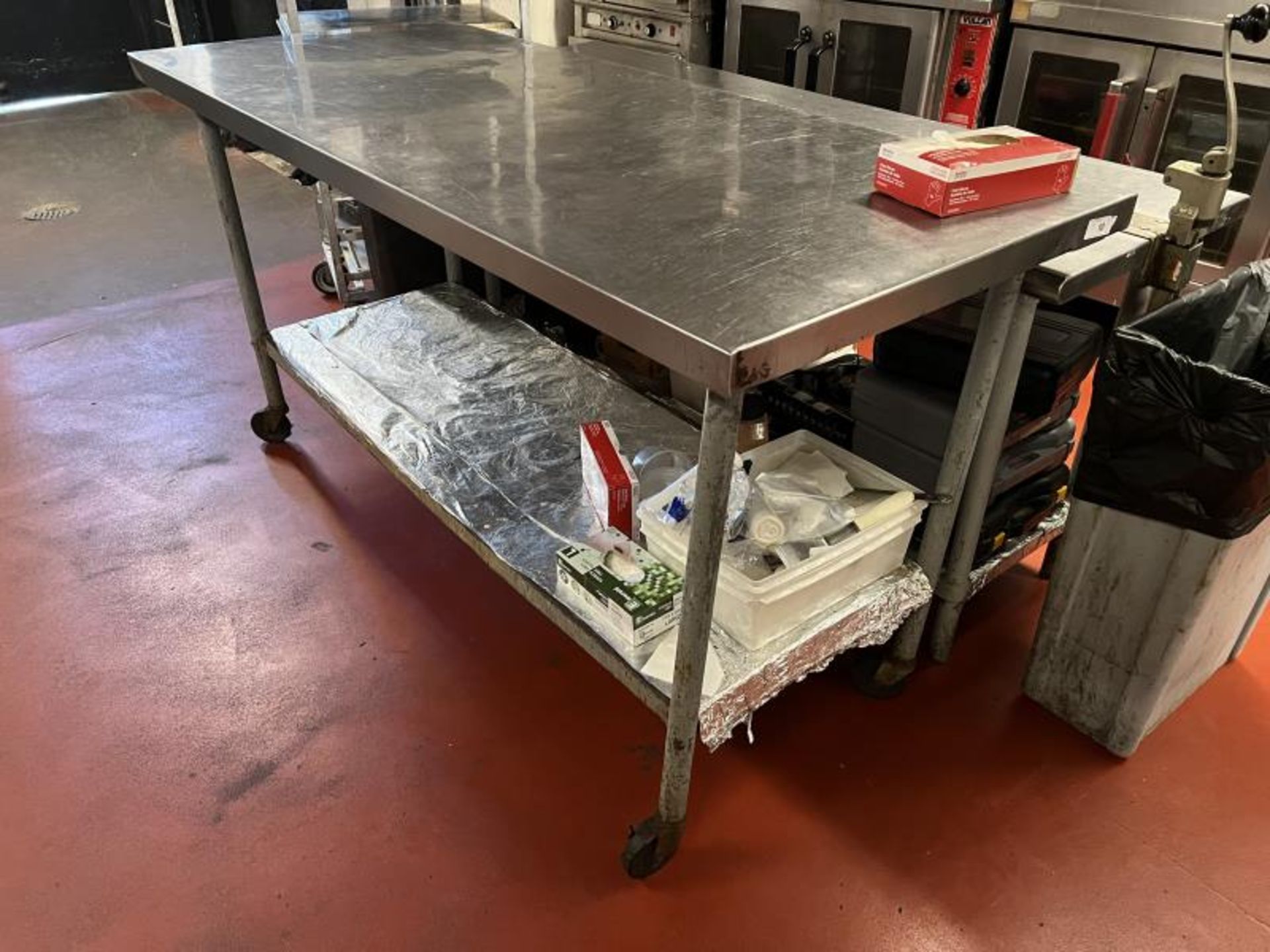 Stainless Steel Prep Table on Casters with Lower Shelf, 6'x2.5' Located in Main Kitchen