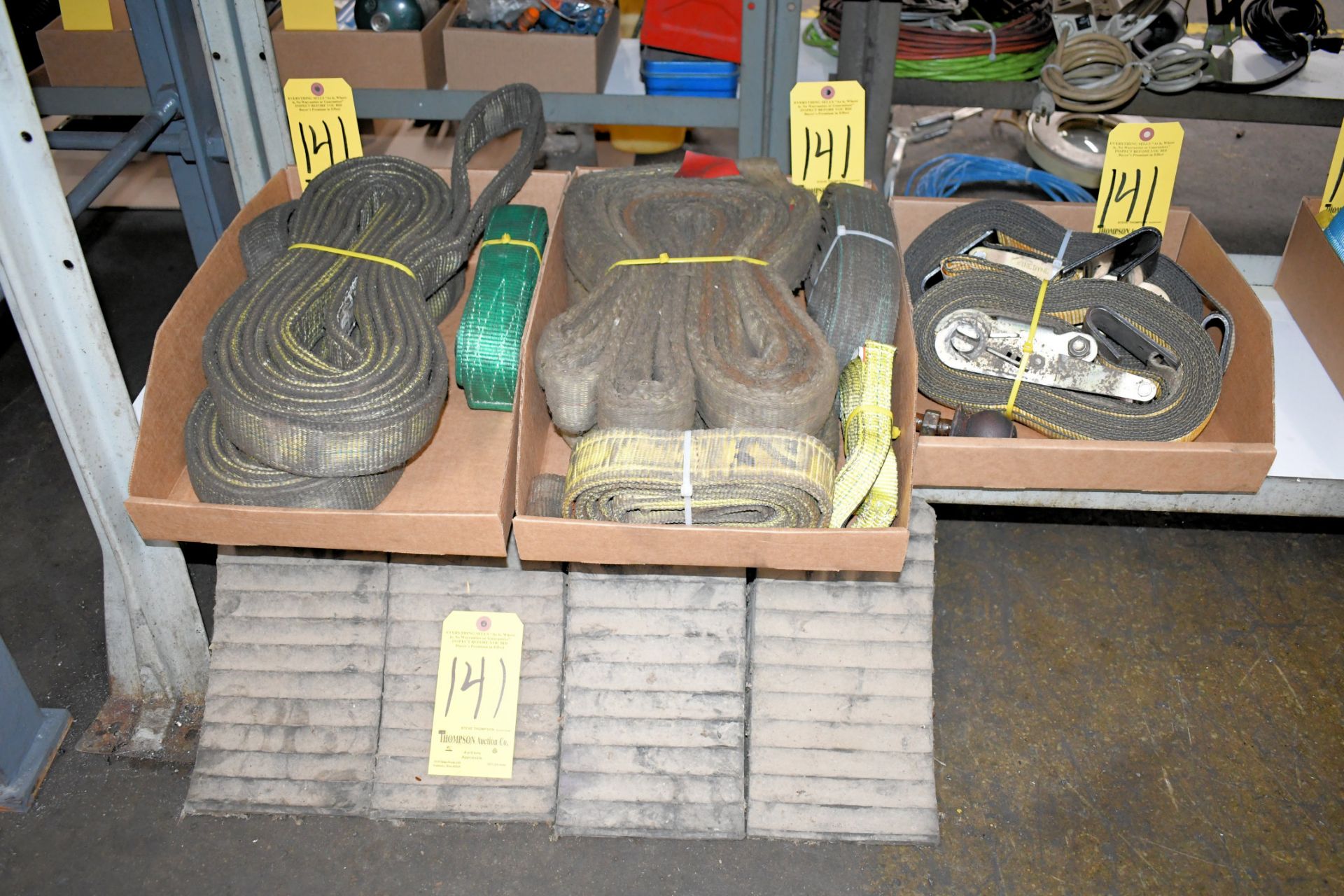 Lot-Large Cloth Slings and (2) Ratchet Straps in (3) Boxes with (4) Wheel Chocks, Under (1) Bench
