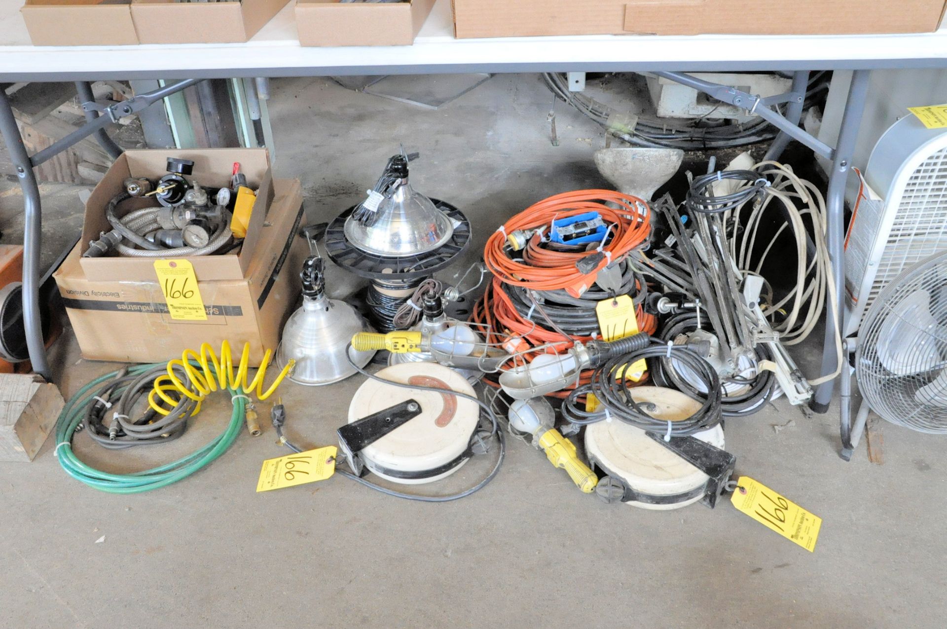 Lot-Extension Cords, Automotive Lights, Work Lights and Cord Reels Under (1) Table