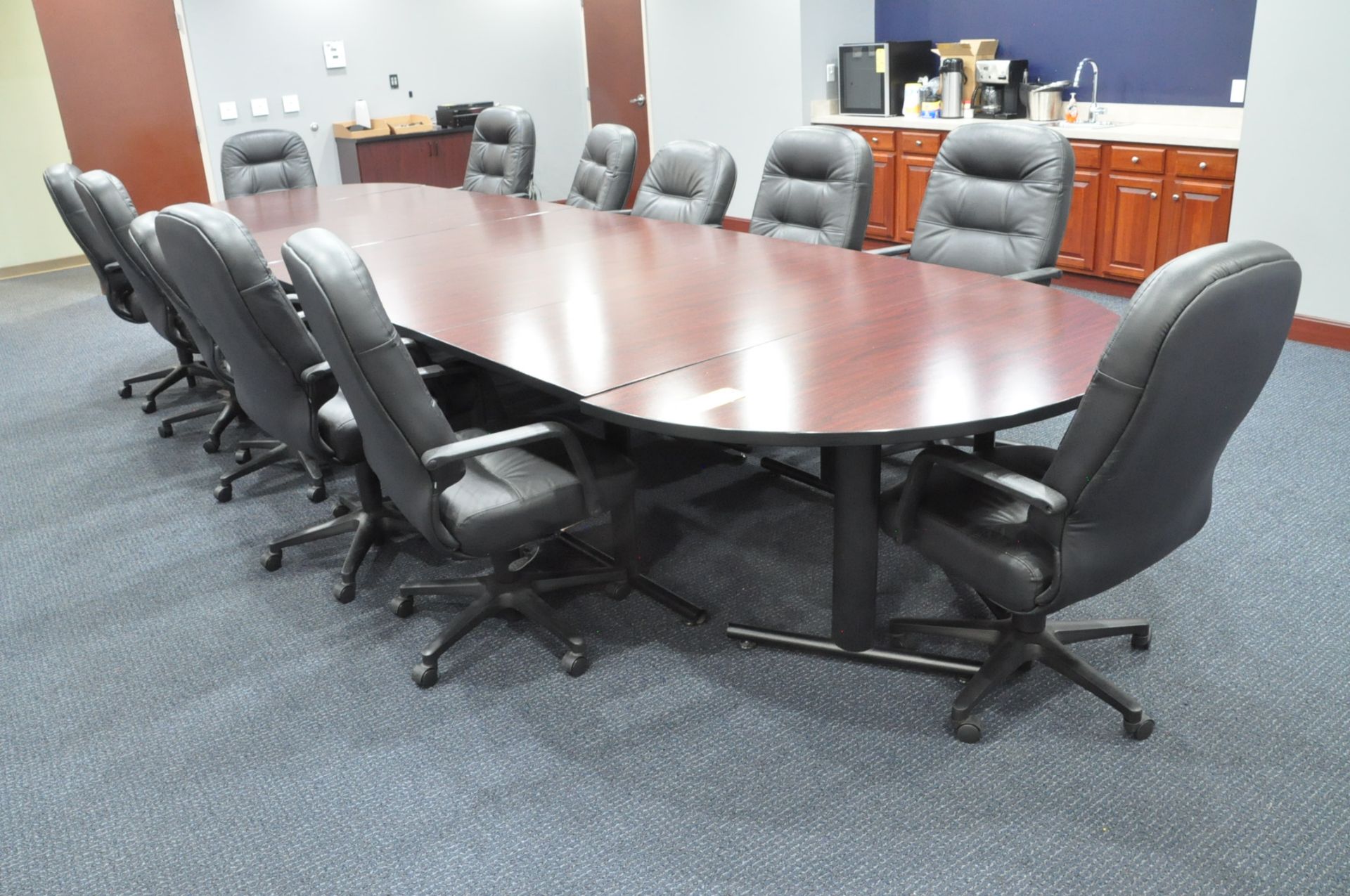 5' x 17' 6" Oval 7-Piece Sectional Conference Table with (12) Black Vinyl Swivel Office Chairs and