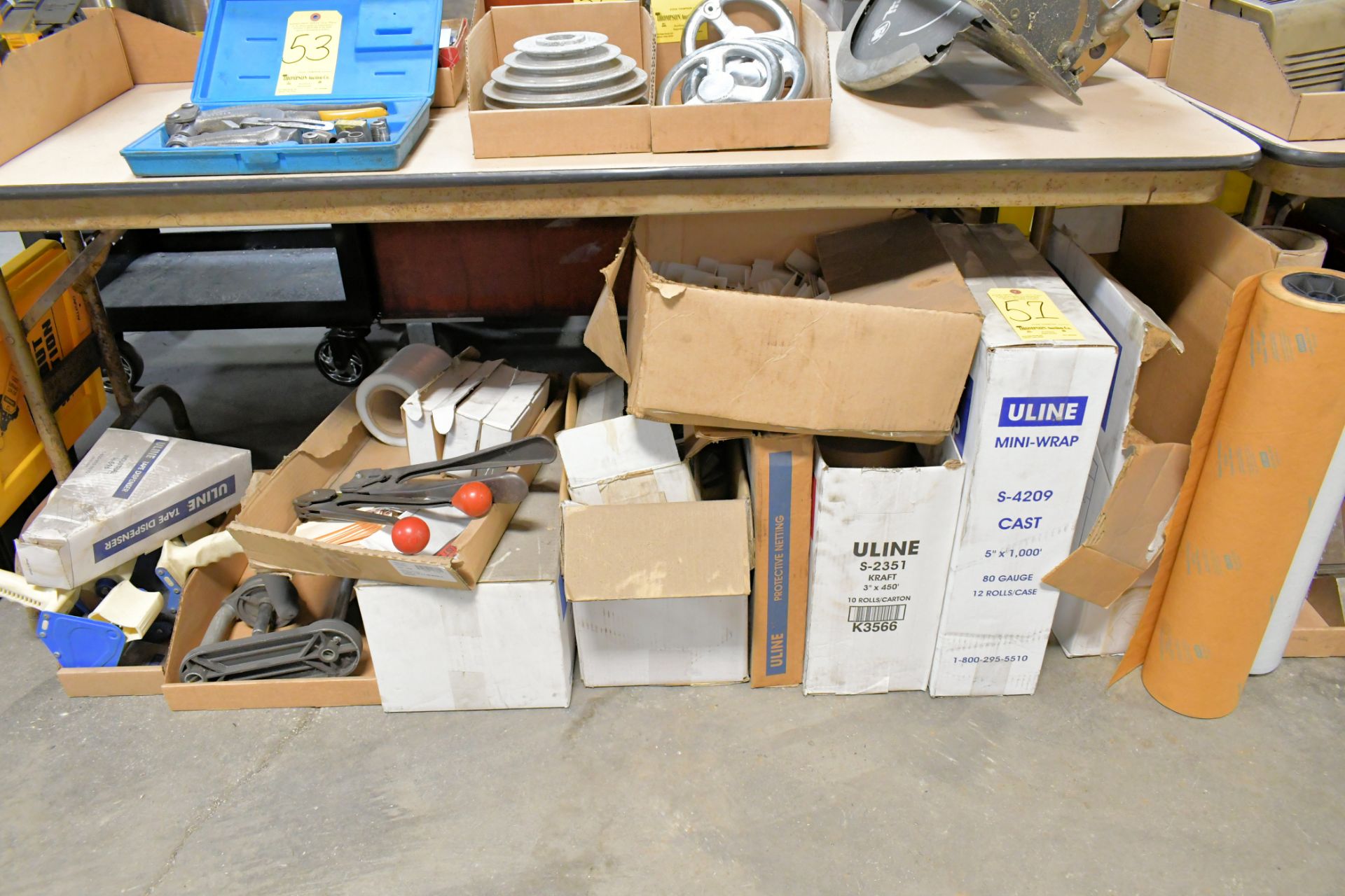 Lot-Stretch Wrap with Dispensers, Corner Guards, Tape Guns, Kraft Paper, Tags, etc. Under (1) Table