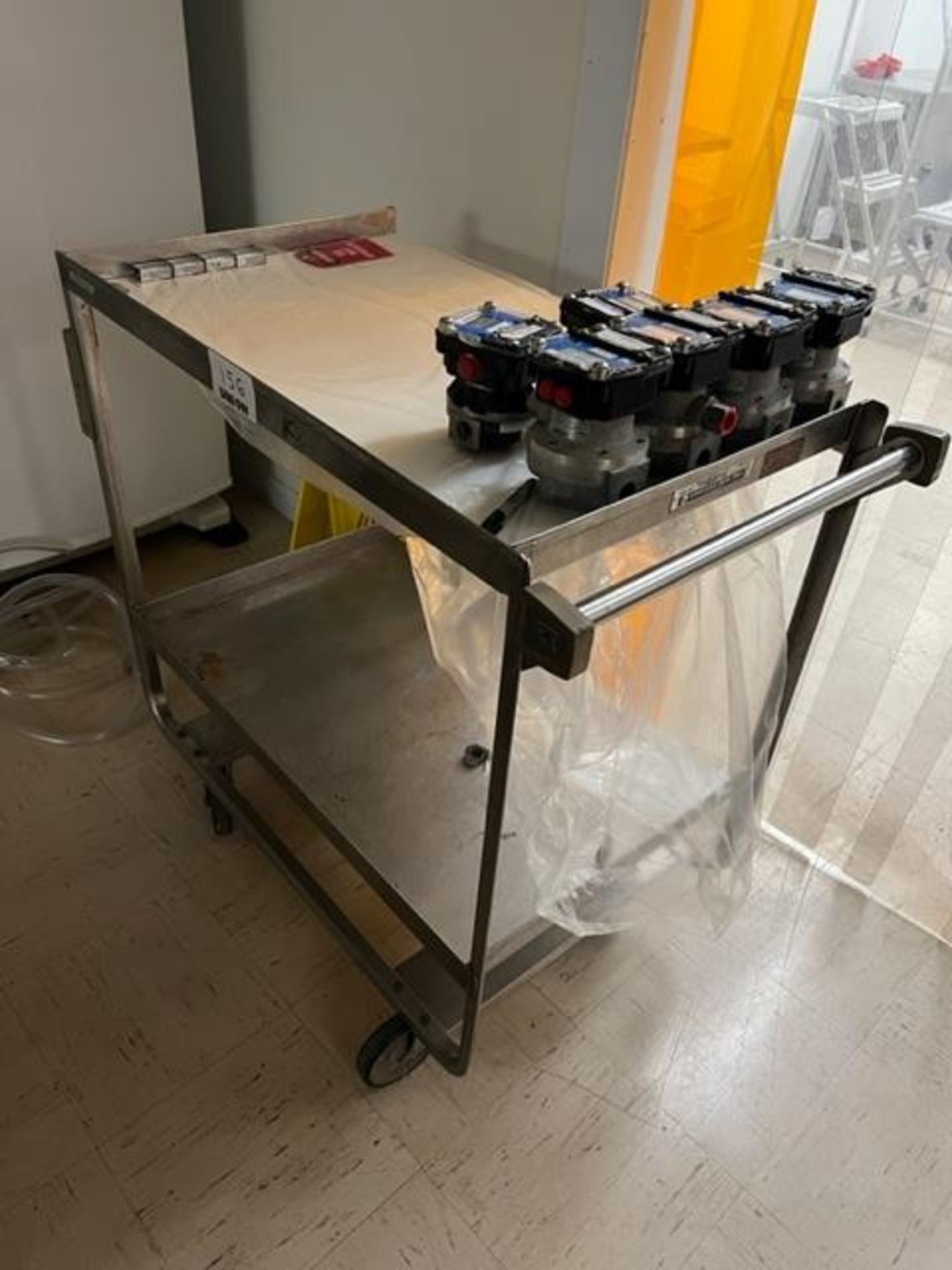 Asset 156 - Two shelf SS cart 33" x 21" on casters with 6 digital flow meters. $345.00 Rigged and