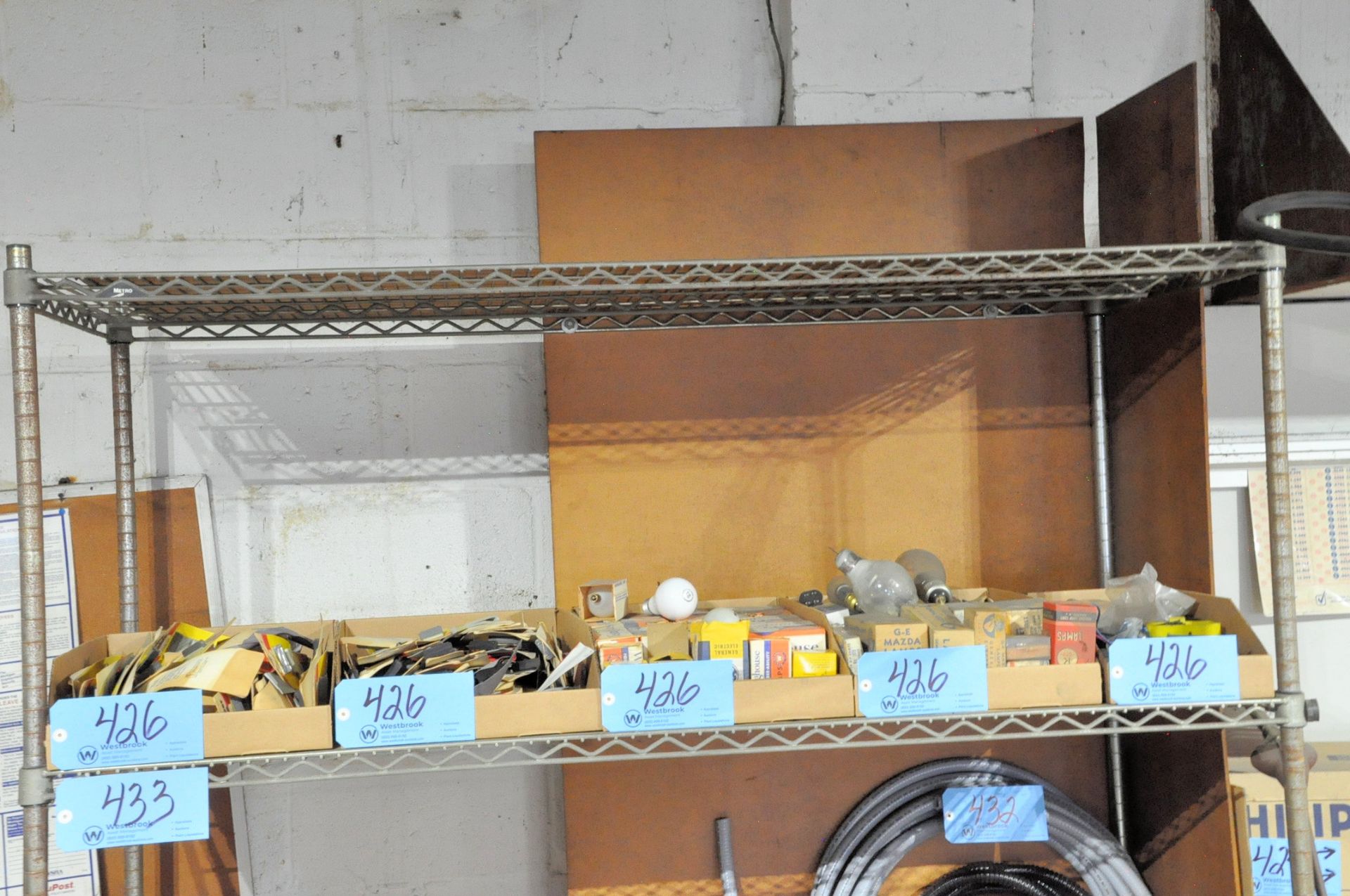 Lot-Various Electronics in (2) Boxes, with Light Bulbs in (3) Boxes on (1) Shelf