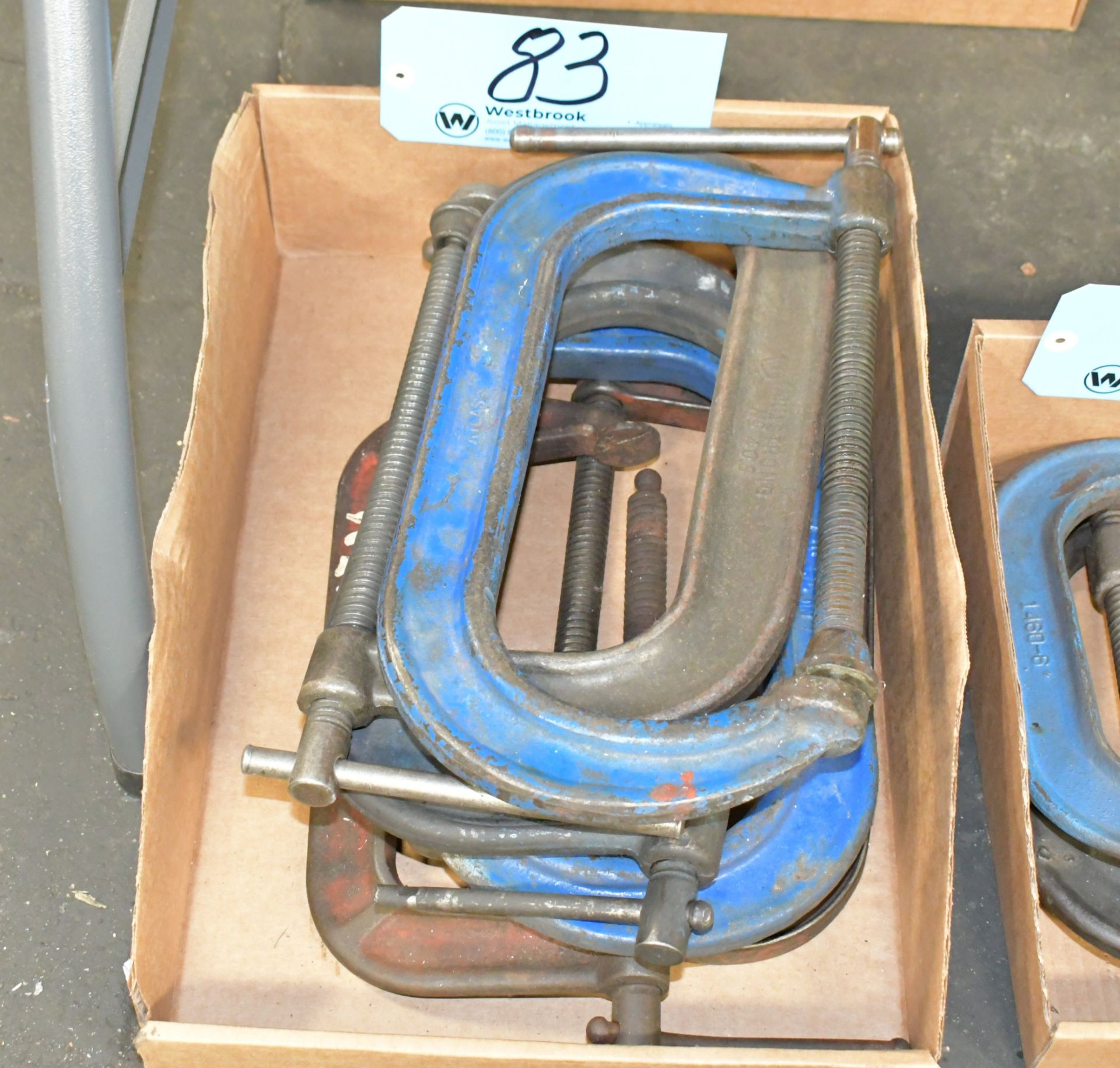 Lot-8" C-Clamps in (1) Box on Floor Under (1) Table