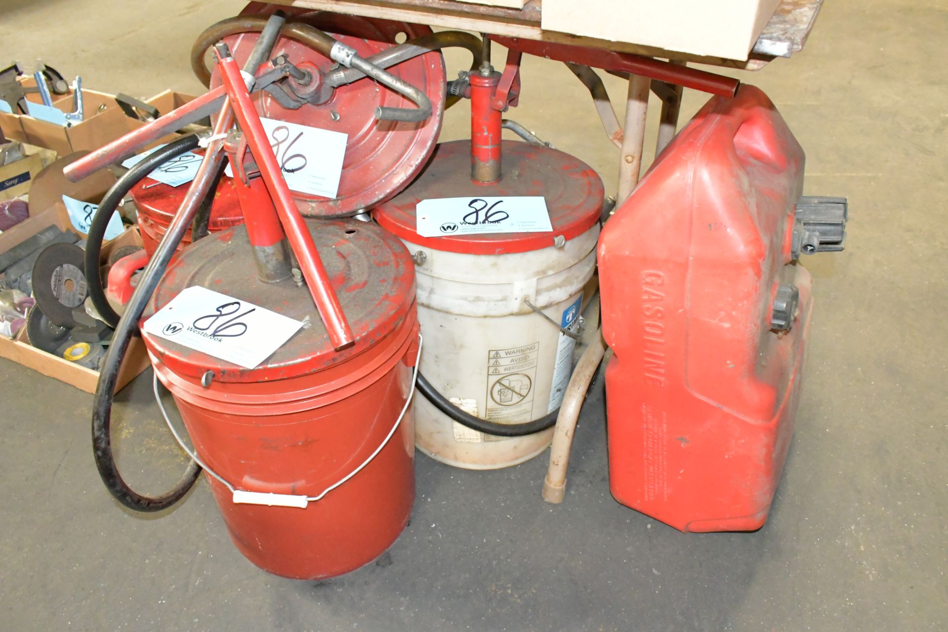 Lot-(3) Manual Pump Fluid Dispensers and (1) Fuel Can on Floor Under (1) Table