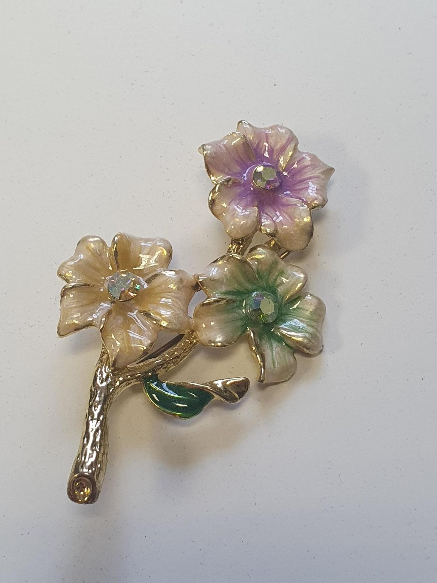 Coloured flowers on stem brooch