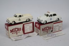 Micro Models - 2 x boxed limited edition Holden Police cars in 1:43 scale,