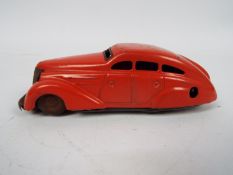 Schuco - A clockwork tinplate Schuco 1010 model car marked made in US-Zone Germany.