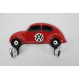 A wall mountable key hook depicting a VW Beetle, 18 cm (l).