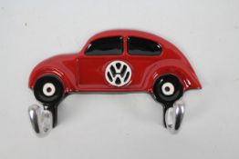 A wall mountable key hook depicting a VW Beetle, 18 cm (l).