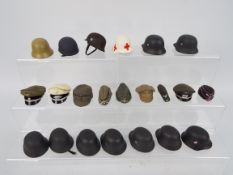 Dragon - DiD - Others - A millinery of 21 German WW2 hats and helmets majority attributed to Dragon