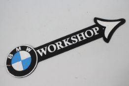 A cast iron, wall mountable, workshop directional sign marked BMW, 46 cm (l).