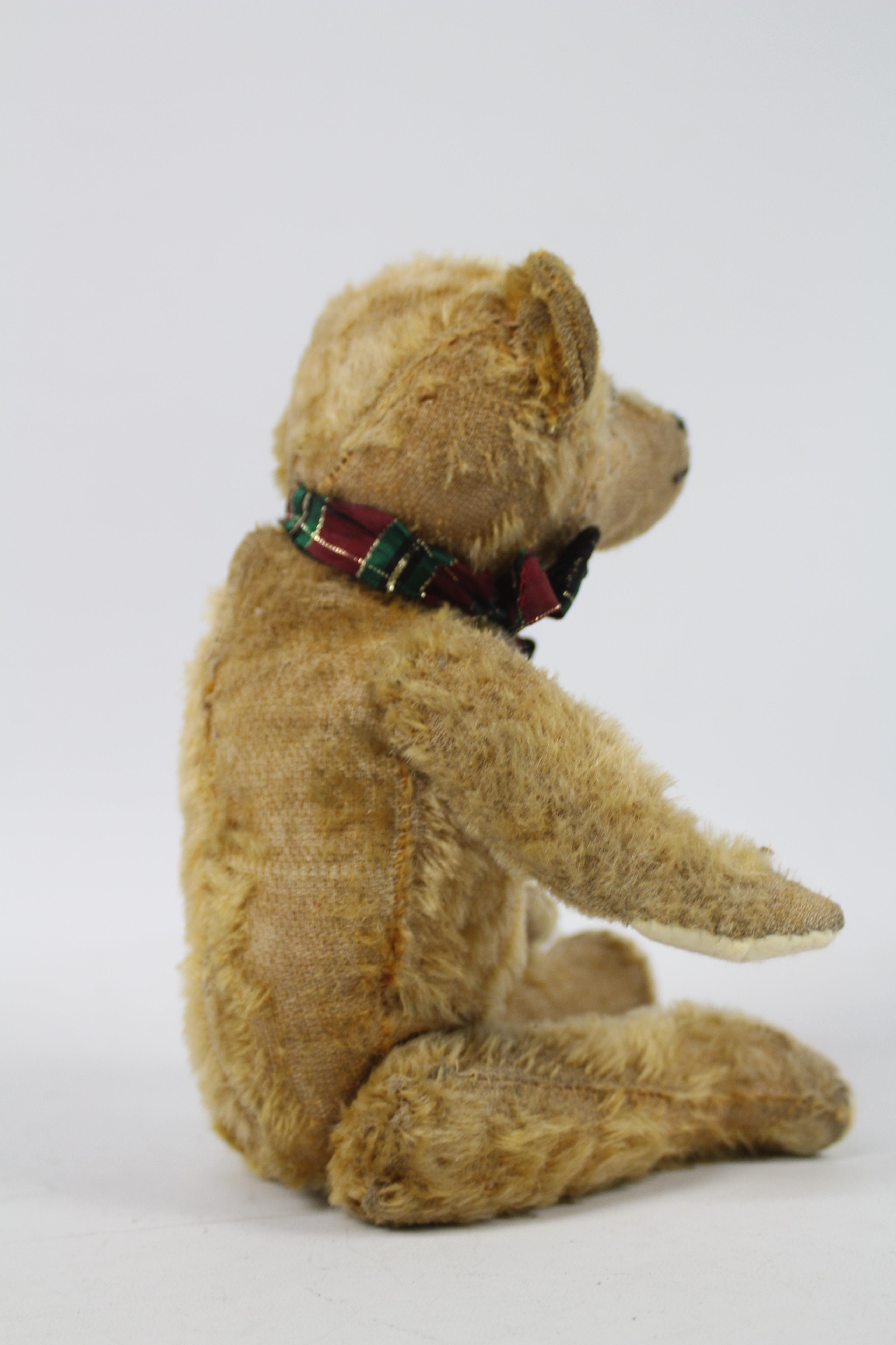 A sawdust filled mohair teddy bear - measuring approx 33 cms in length, having jointed limbs, - Image 4 of 5