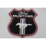 A cast iron wall plaque marked Ford Mustang, approximately 25 cm x 24 cm.