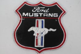 A cast iron wall plaque marked Ford Mustang, approximately 25 cm x 24 cm.