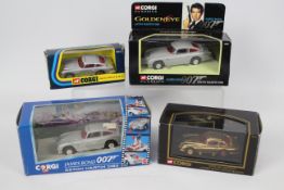 Corgi - James Bond - 4 x boxed Aston Martin DB5 models including limited edition gold finish model