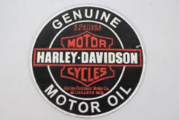 A cast iron wall plaque marked Harley - Davidson Motor Cycles, approximately 24 cm (d).