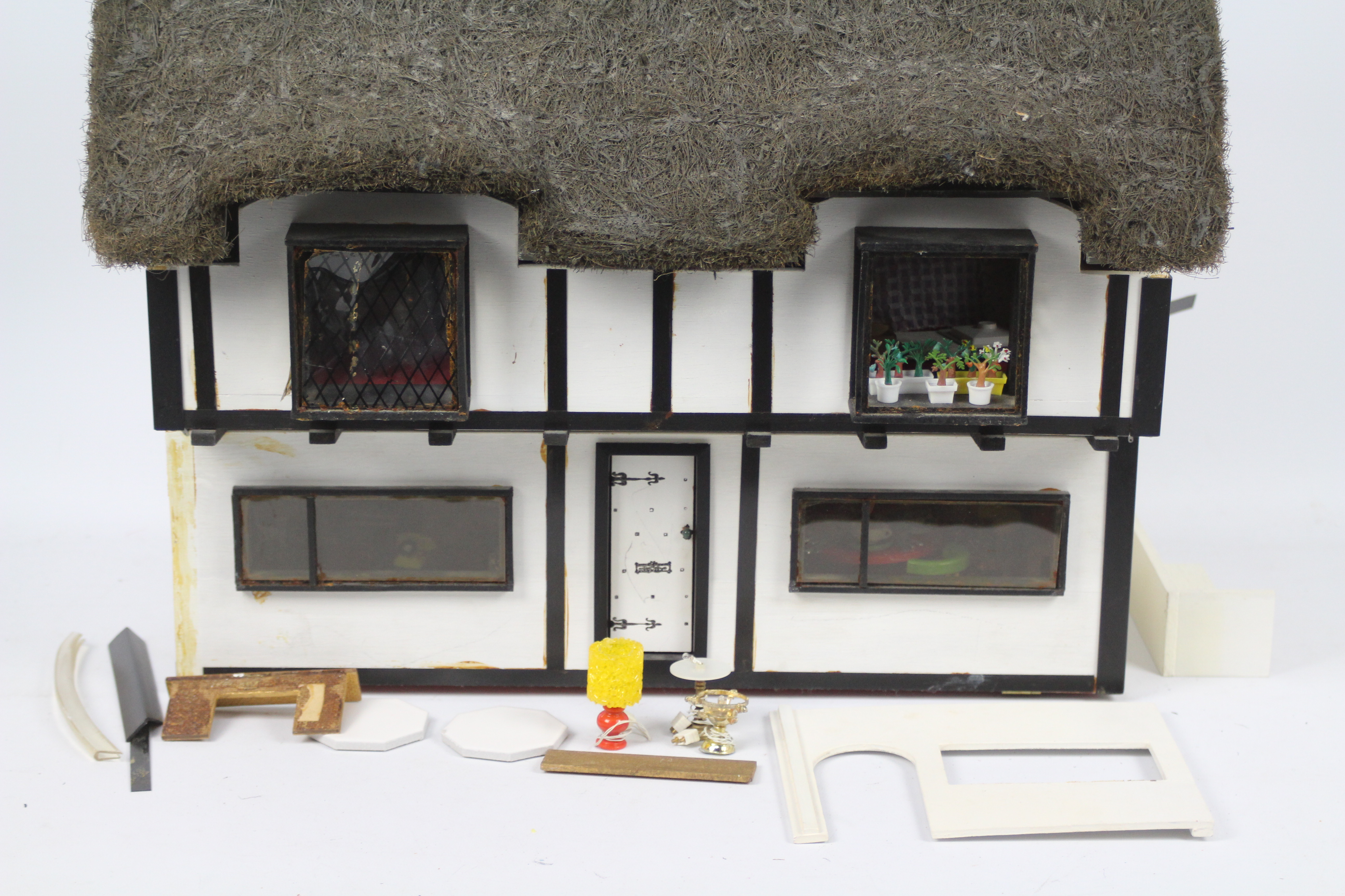 Dolls house - A home made, wooden, thatched, dolls house with electricity fittings for lights. - Image 2 of 4