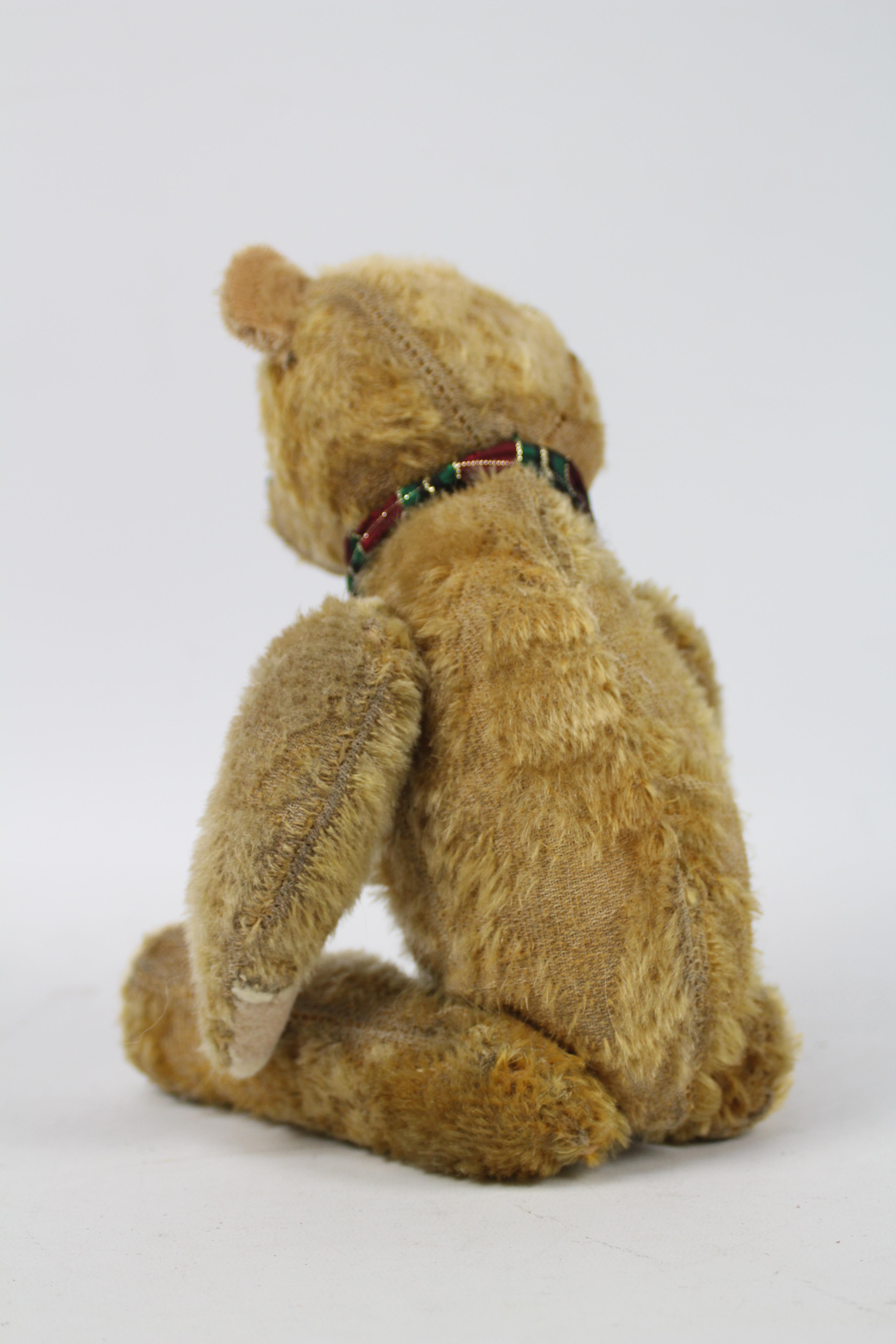 A sawdust filled mohair teddy bear - measuring approx 33 cms in length, having jointed limbs, - Image 5 of 5