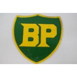 A large cast iron wall plaque marked BP, approximately 34 cm x 33 cm.