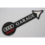 A wall mountable, cast iron, garage directional sign bearing Audi logo, 44 cm (l).