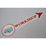 A wall mountable, cast iron, directional workshop sign with image of VW camper van, 45 cm (l).