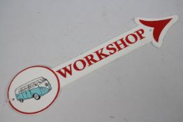 A wall mountable, cast iron, directional workshop sign with image of VW camper van, 45 cm (l).