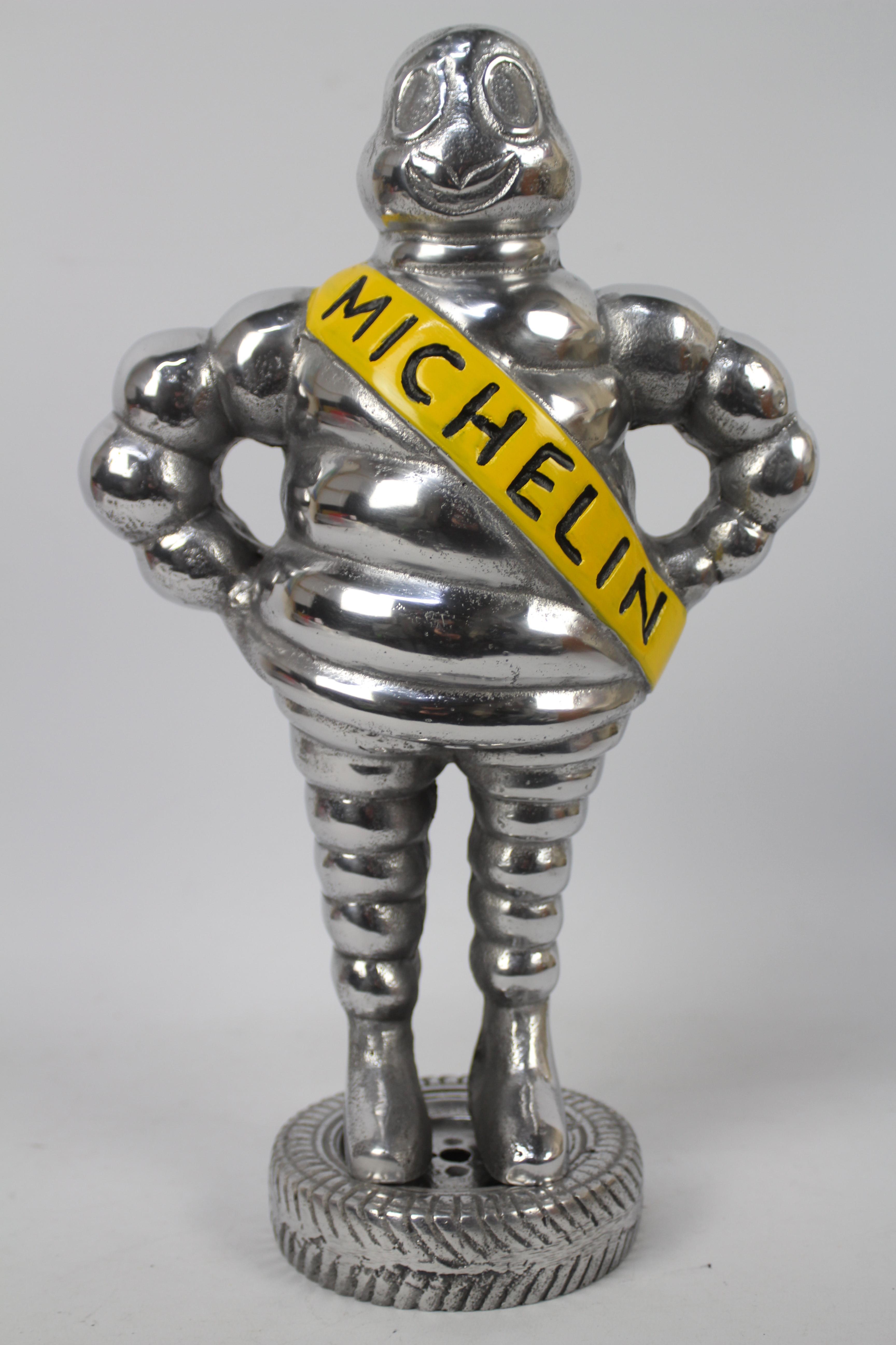 A large aluminium model depicting Bibendum (Michelin man), approximately 48 cm (h).