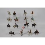 Timpo - Britains - Others - A collection of sixteen mounted Western themed metal figures by various