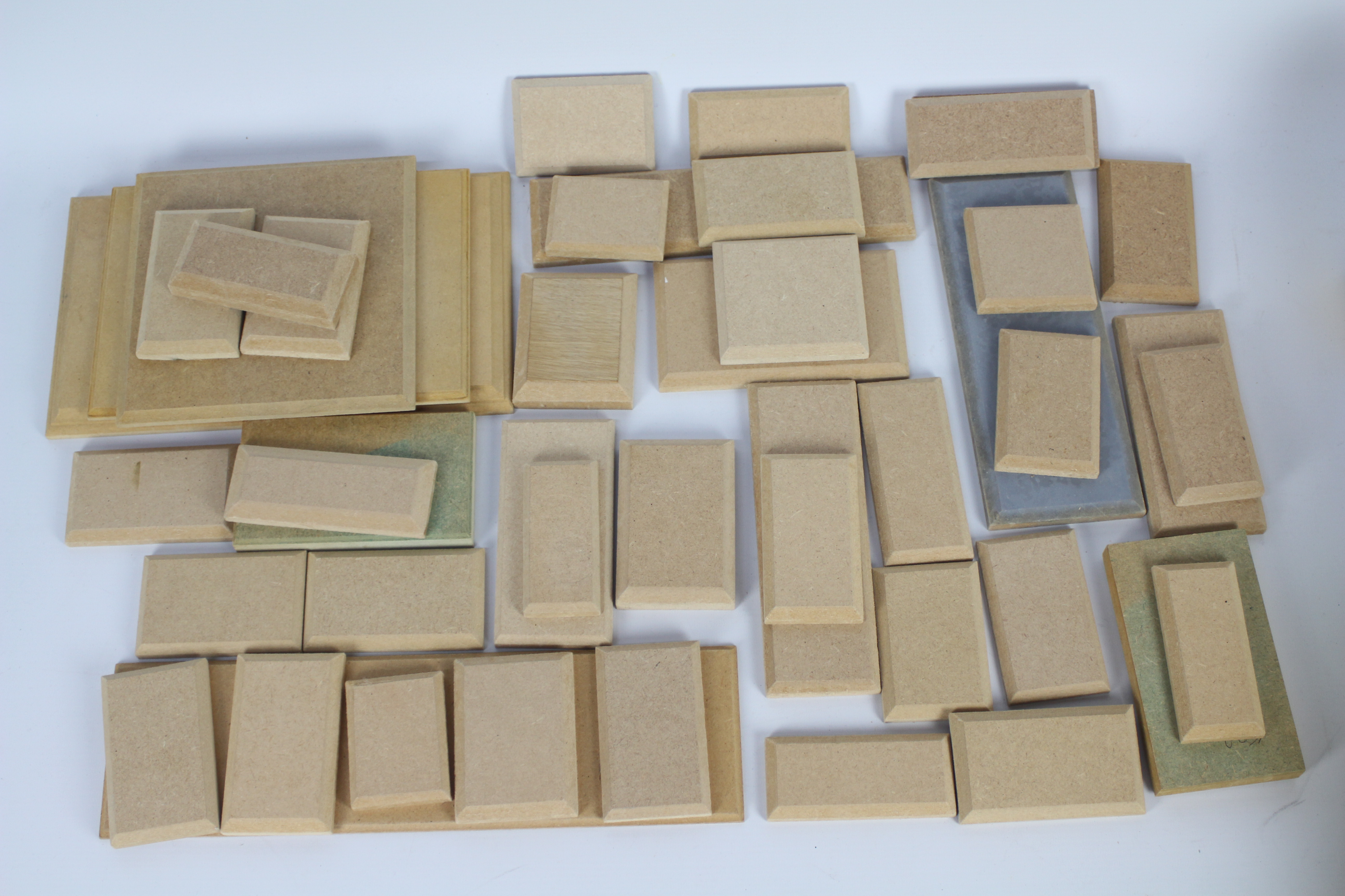 Approximately 45 wooden / MDF model display plinths