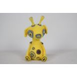 Unknown Maker - A yellow-coloured animal with glass eyes.