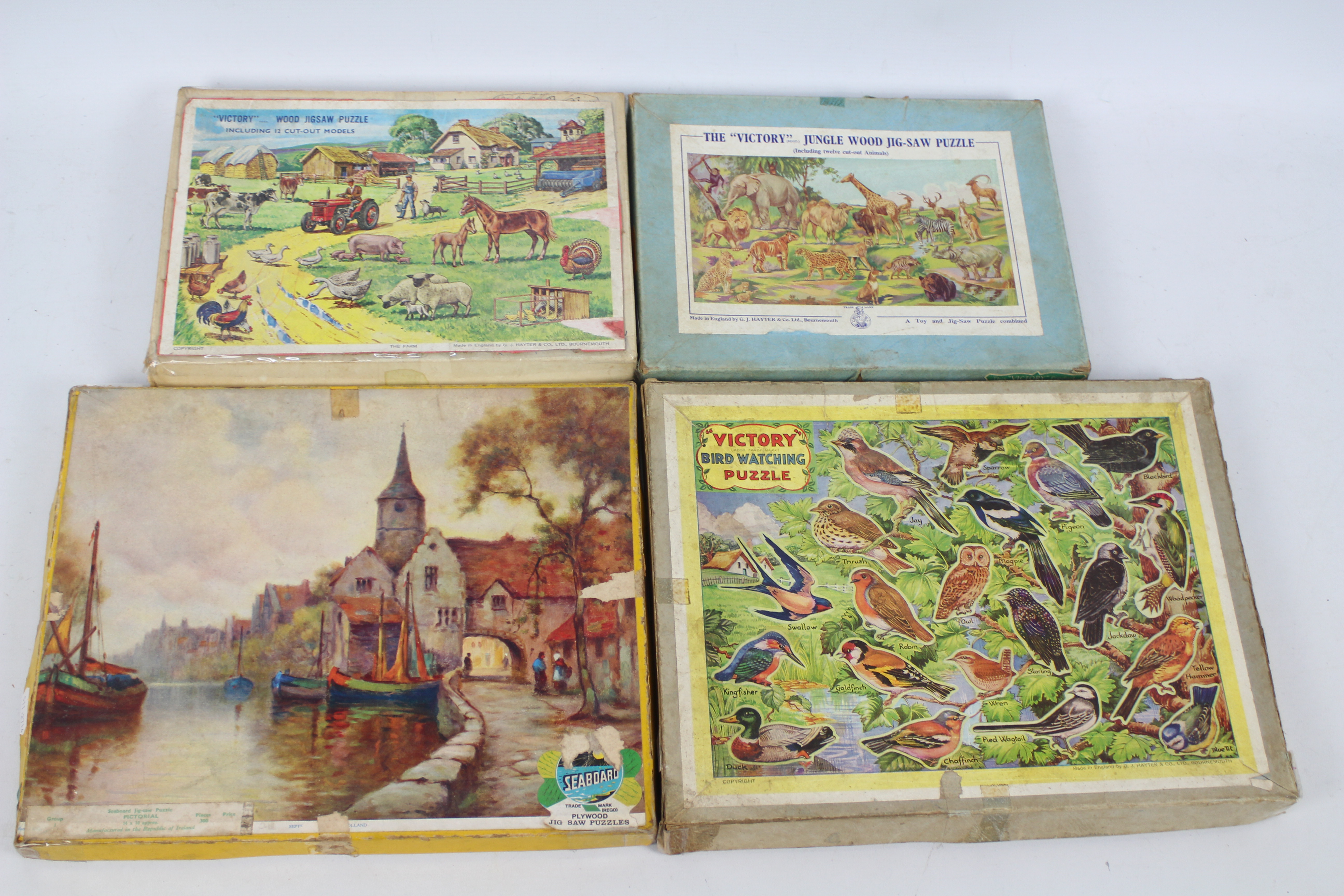 Victory Puzzle ; Seaboard - Four vintage wooden / plywood jigsaw puzzles.