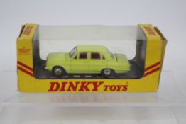 Dinky - A boxed Dinky Vauxhall Victor 101 in the rare yellow finish in the export style window box