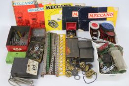 Meccano. A set of vintage Meccano, loose and in various tins.