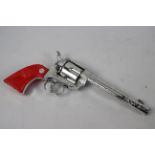 Crescent Toy Company - A Crescent toy Rustler 45 cap gun with working mechanism.