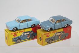 Dinky - 2 x boxed Ford Cortina Mk1 models # 139, one in light blue and one in metallic blue.