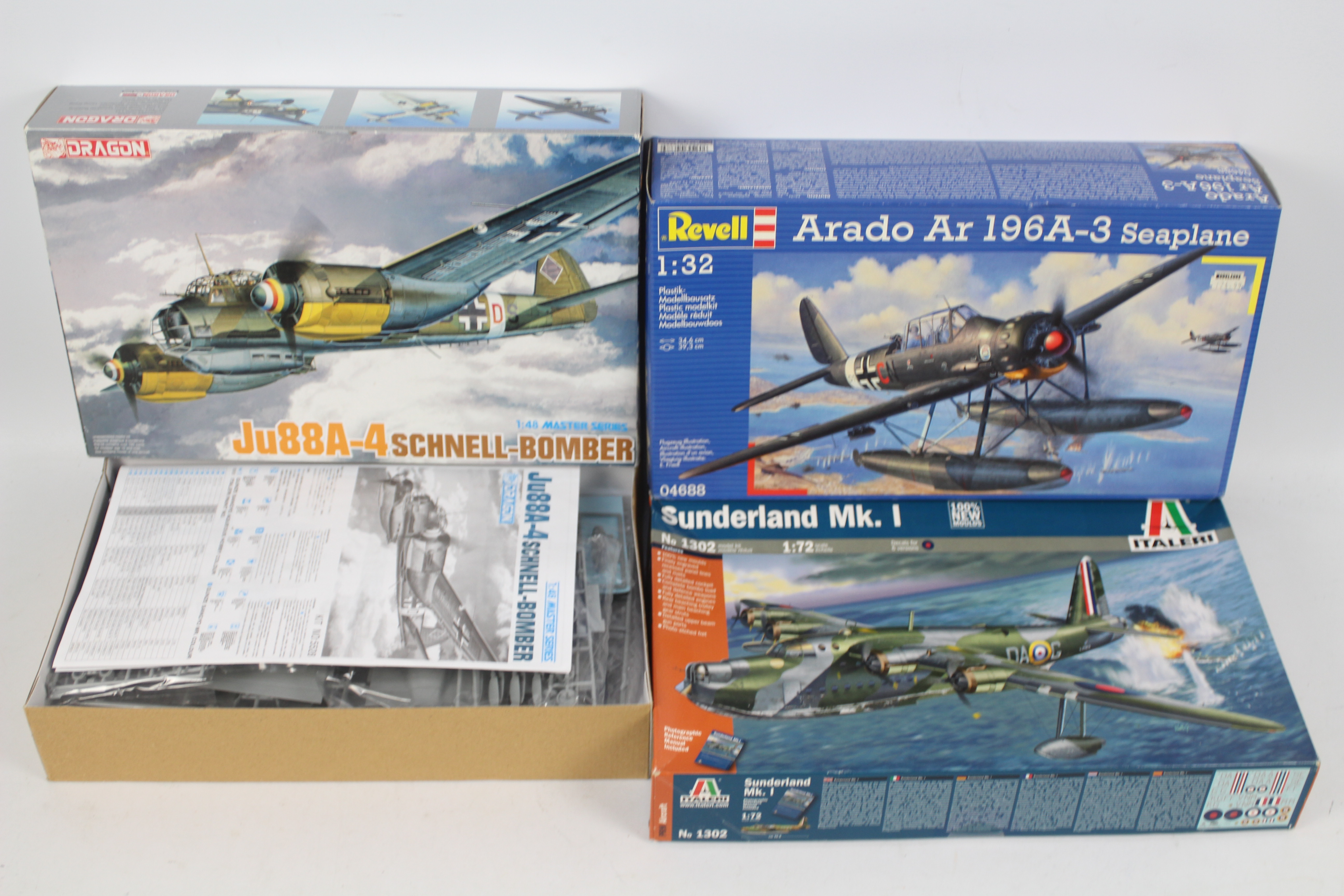 Italeri - Revell - Dragon - Three boxed military aircraft plastic model kits in various scales.