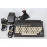 Commodore - A vintage Commodore plus/4 console with power lead and a controller. # 264 Series.