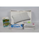 Nintendo - A boxed Wii Fit Board with some boxed accessories, Sports Pack,
