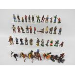 A collection of cast metal figures, predominantly military, Wild West and similar,