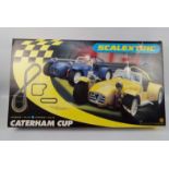 Scalextric - A boxed Scalextric Caterham Cup set # C1034.