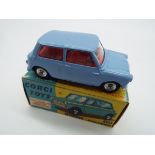 Corgi - a diecast model Morris Mini-Minor, pale blue body and chassis, red interior, steering wheel,