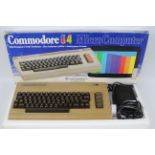 Commodore - A boxed Commodore 64 Computer with power lead.