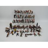A collection of various metal figures, predominantly military,